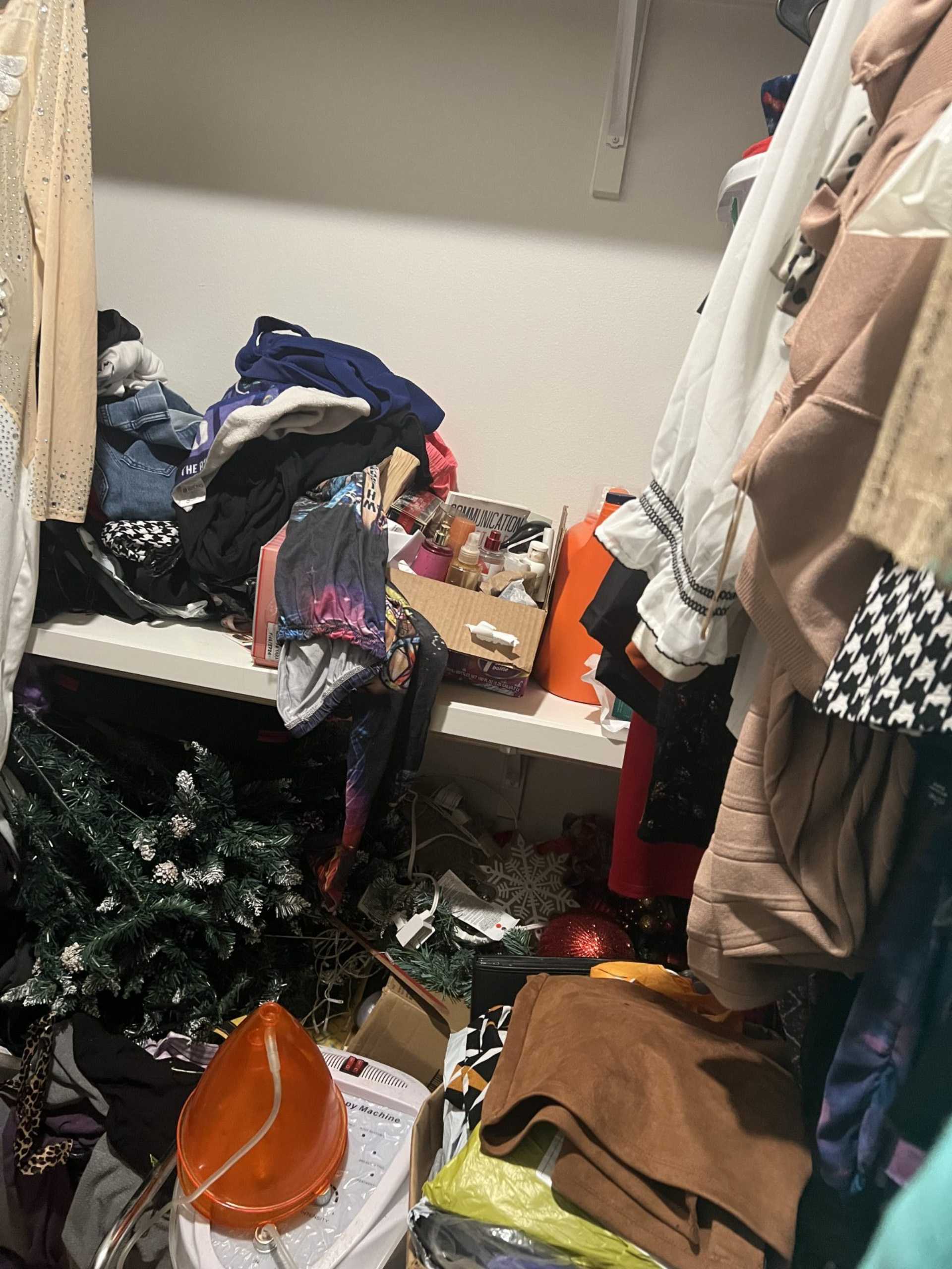 Cluttered closet filled with clothes